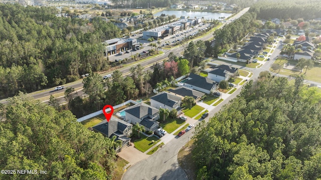 aerial view featuring a water view and a residential view