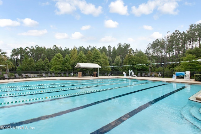 pool featuring a patio area and fence