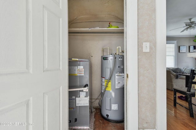 utility room featuring water heater