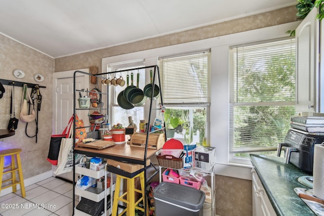 dining space featuring tile patterned flooring