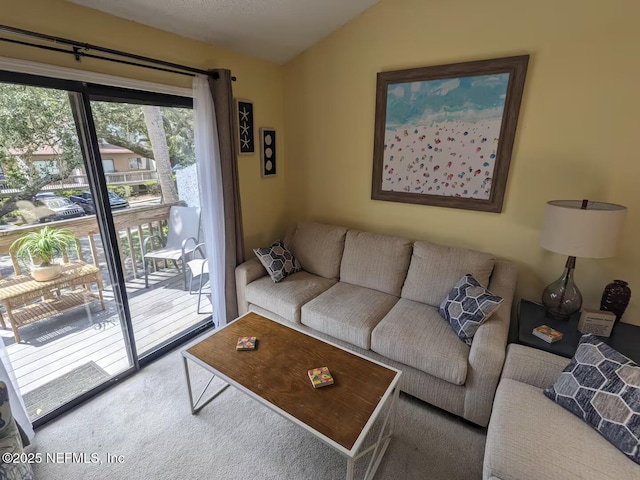 carpeted living room with vaulted ceiling