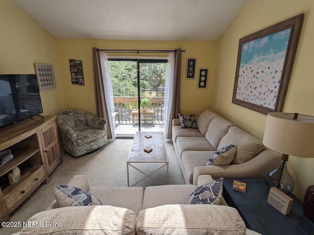 carpeted living area featuring vaulted ceiling and a textured ceiling