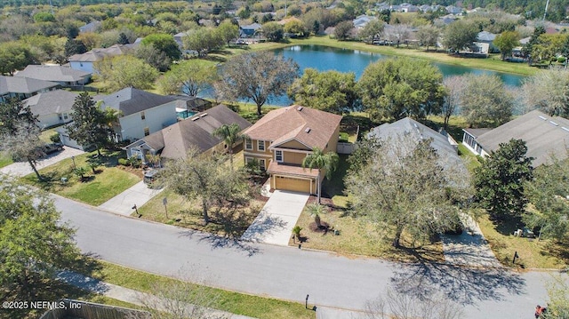 birds eye view of property featuring a residential view and a water view