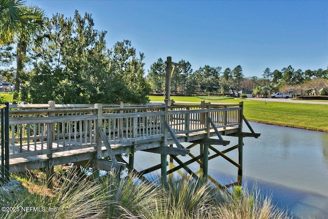 dock area featuring a yard and a water view