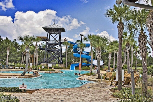 view of pool featuring a water slide