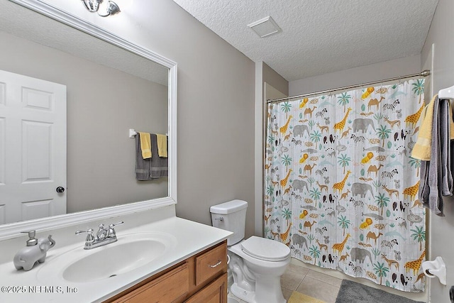 full bath with visible vents, toilet, a textured ceiling, tile patterned flooring, and vanity