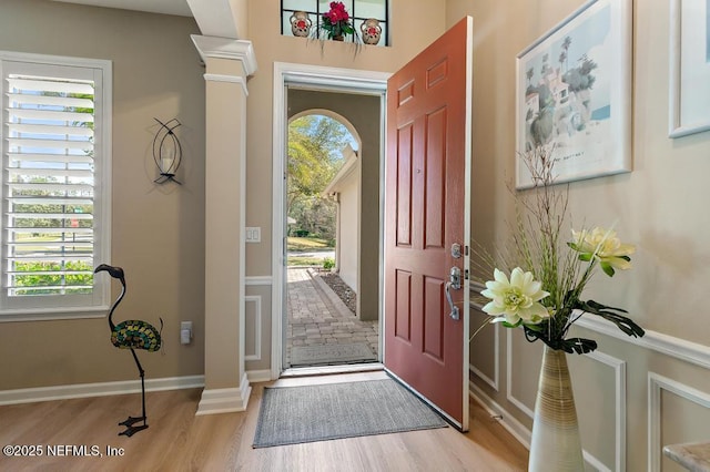 entrance foyer featuring baseboards and wood finished floors