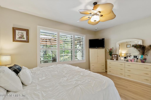 bedroom with light wood-style flooring and ceiling fan