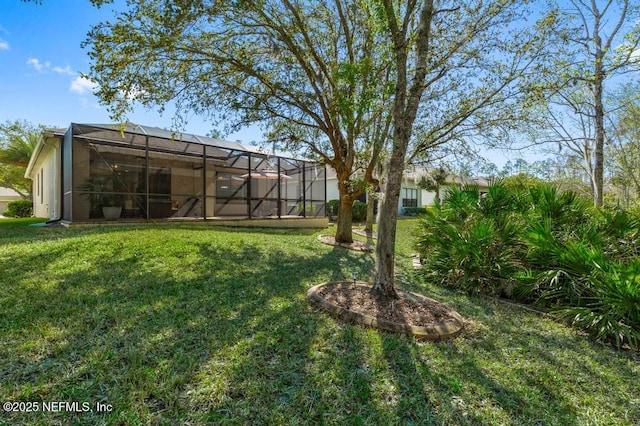 view of yard with a lanai