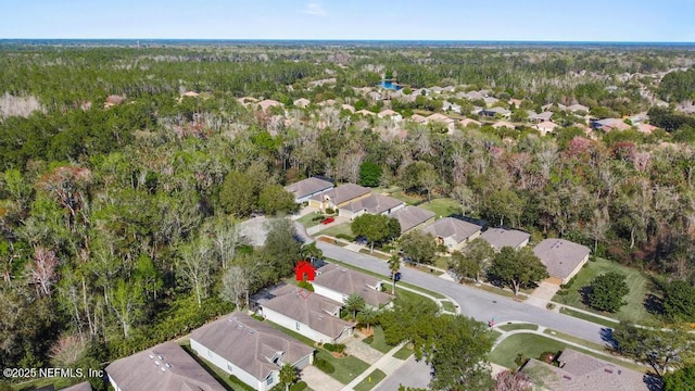 aerial view with a residential view and a wooded view