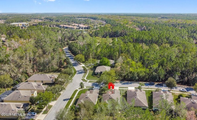 aerial view with a residential view and a view of trees