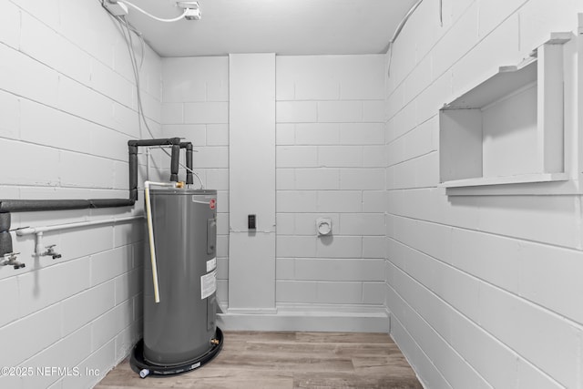 utility room featuring electric water heater