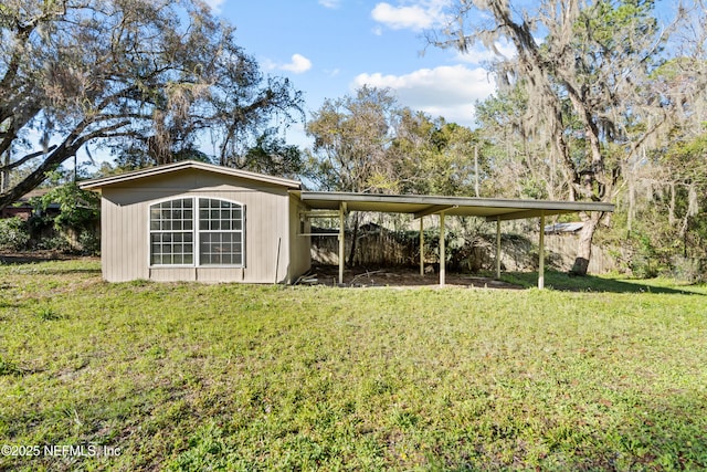 view of outdoor structure featuring an attached carport and an outdoor structure