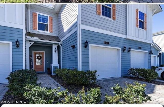 view of front of house with a garage and board and batten siding