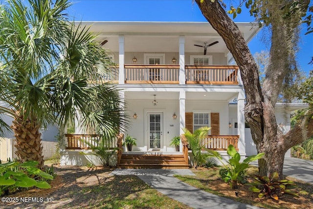 view of front of house featuring a balcony and a porch