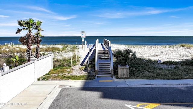1306 1st St S, Jacksonville Beach, FL 32250 - water view featuring a beach view, stairs, and fence