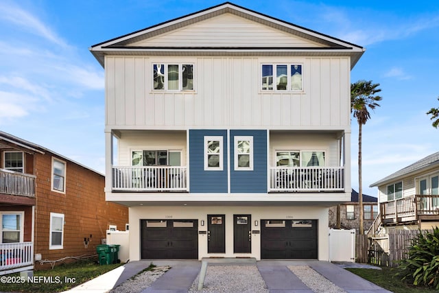 1306 1st St S, Jacksonville Beach, FL 32250 - raised beach house featuring an attached garage, board and batten siding, and fence