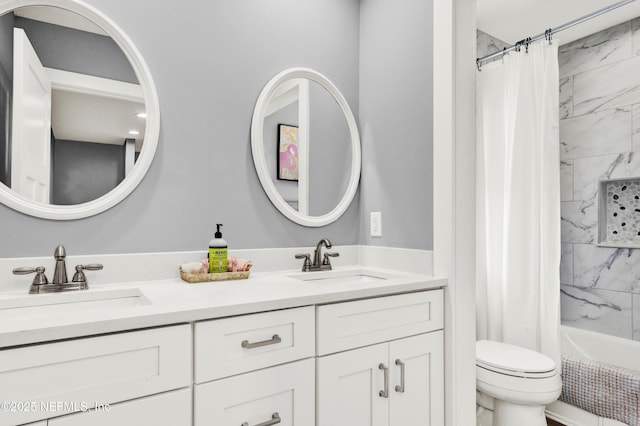 1306 1st St S, Jacksonville Beach, FL 32250 - bathroom featuring a sink, shower / bath combo with shower curtain, toilet, and double vanity
