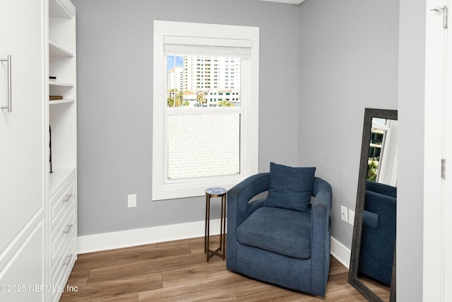 1306 1st St S, Jacksonville Beach, FL 32250 - sitting room featuring a wealth of natural light, baseboards, and wood finished floors