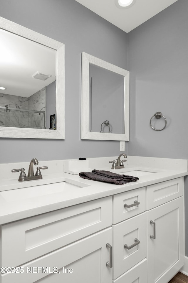 1306 1st St S, Jacksonville Beach, FL 32250 - full bathroom with double vanity, a shower, and a sink