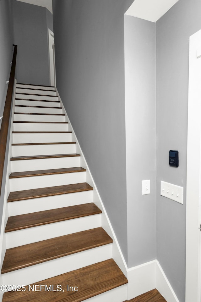 1306 1st St S, Jacksonville Beach, FL 32250 - stairway featuring wood finished floors and baseboards