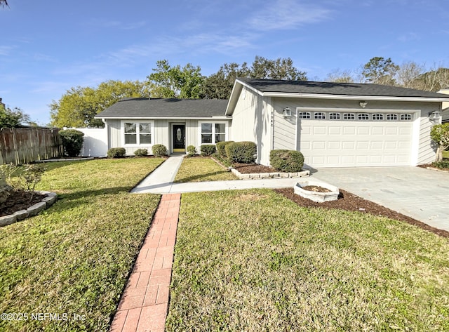 view of front of home featuring a garage, driveway, a front lawn, and fence