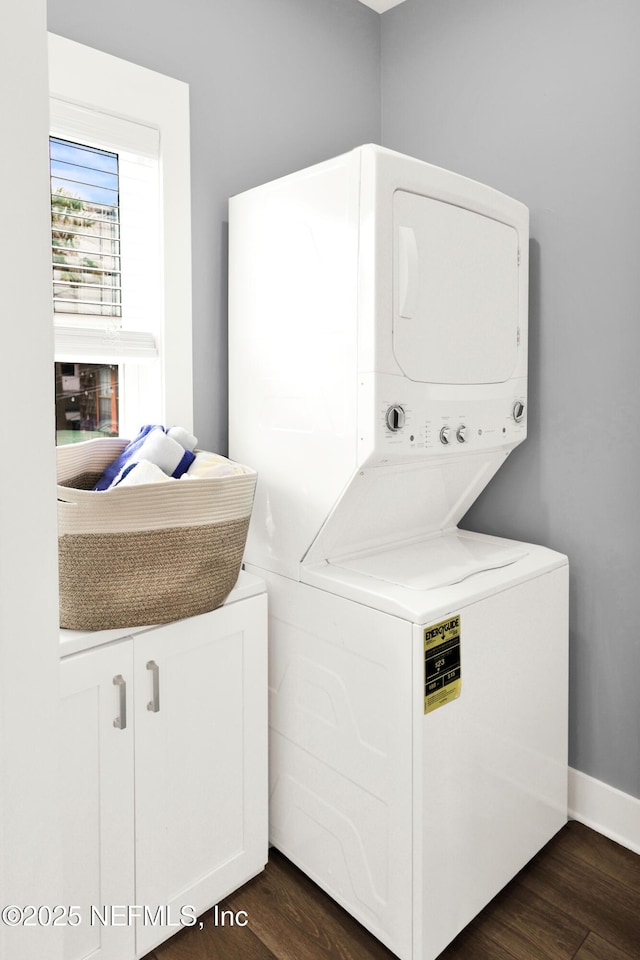 1308 1st St S, Jacksonville Beach, FL 32250 - clothes washing area featuring stacked washer and clothes dryer, baseboards, laundry area, and dark wood finished floors