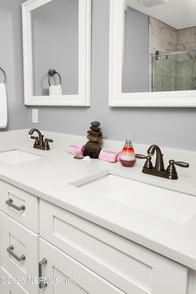 1308 1st St S, Jacksonville Beach, FL 32250 - full bathroom featuring a stall shower, double vanity, and a sink