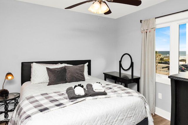 1308 1st St S, Jacksonville Beach, FL 32250 - bedroom with baseboards, wood finished floors, and a ceiling fan