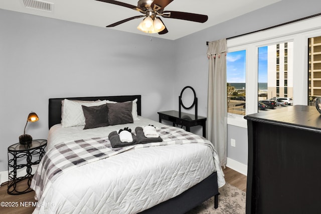 1308 1st St S, Jacksonville Beach, FL 32250 - bedroom with baseboards, ceiling fan, visible vents, and wood finished floors