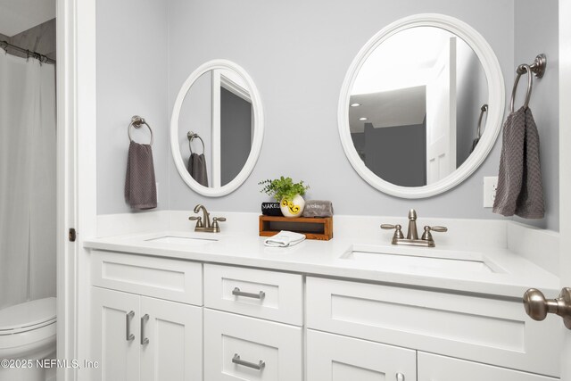 1308 1st St S, Jacksonville Beach, FL 32250 - bathroom with double vanity, a sink, and toilet