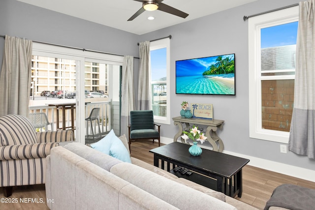 1308 1st St S, Jacksonville Beach, FL 32250 - living area featuring baseboards, wood finished floors, and ceiling fan