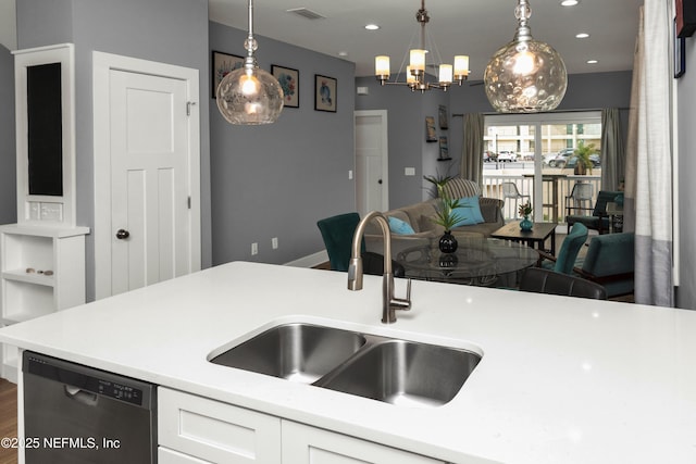 1308 1st St S, Jacksonville Beach, FL 32250 - kitchen featuring light countertops, visible vents, white cabinetry, a sink, and stainless steel dishwasher