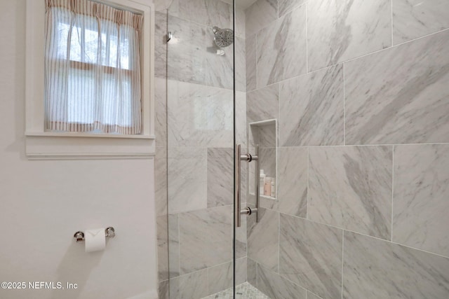 full bath featuring a tile shower