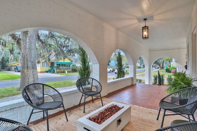 view of patio featuring an outdoor fire pit