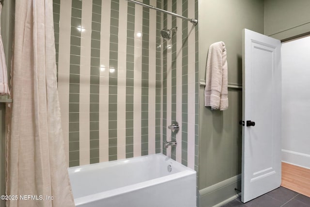 bathroom featuring tile patterned floors and shower / bath combo with shower curtain