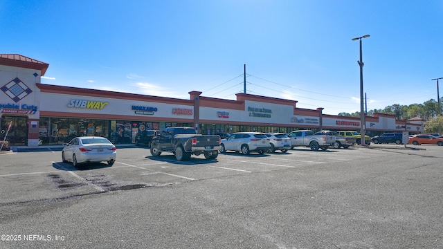 view of property featuring uncovered parking