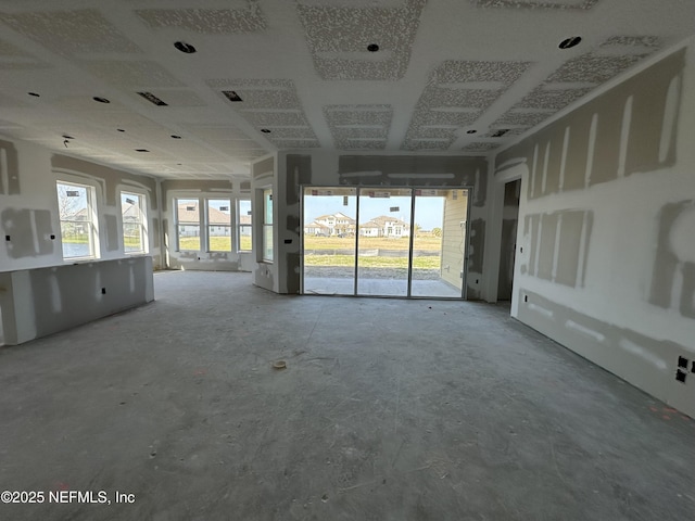 unfurnished living room with visible vents