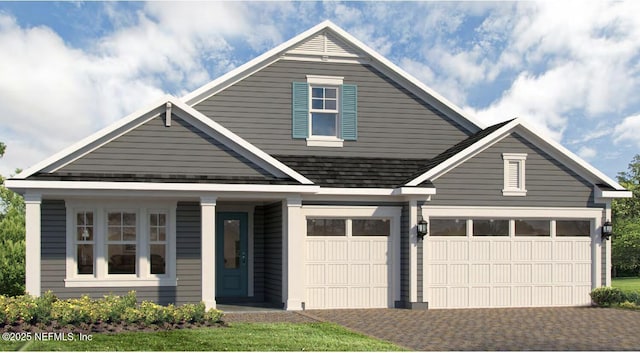 view of front of property with a garage and driveway