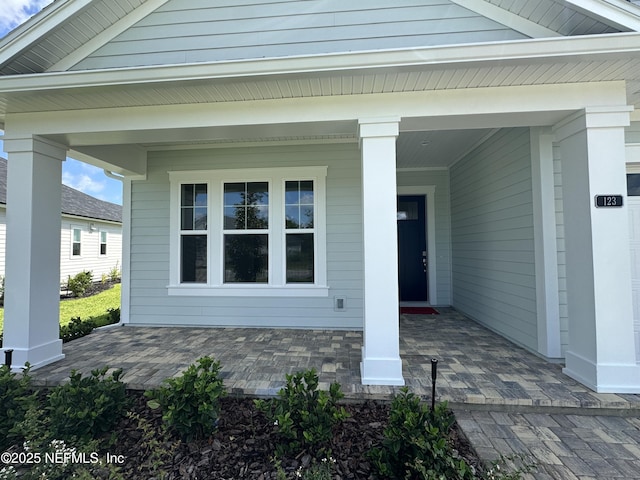 123 Tesoro Ter, Saint Augustine, FL 32095 - view of exterior entry with a porch