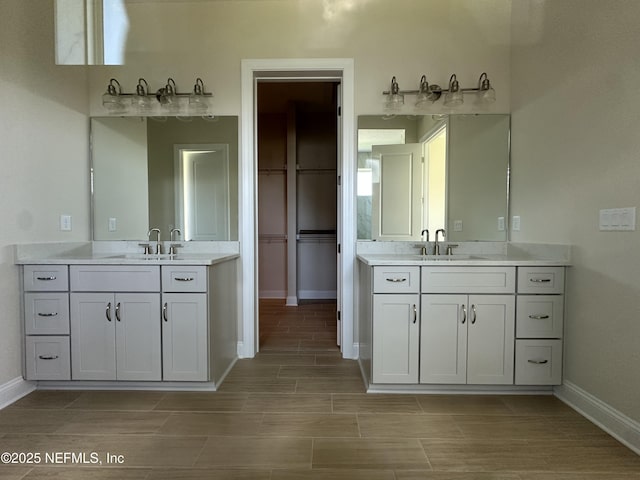 123 Tesoro Ter, Saint Augustine, FL 32095 - bathroom with two vanities and wood finish floors