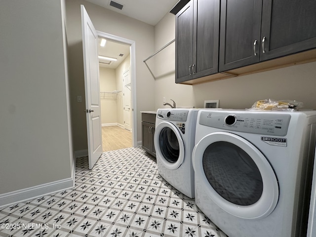 123 Tesoro Ter, Saint Augustine, FL 32095 - laundry room with cabinet space, washer and clothes dryer, and light flooring