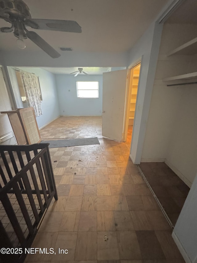 hall featuring visible vents and tile patterned floors