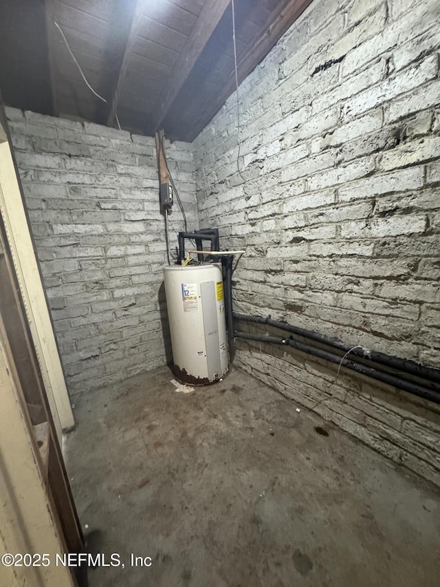 utility room featuring water heater