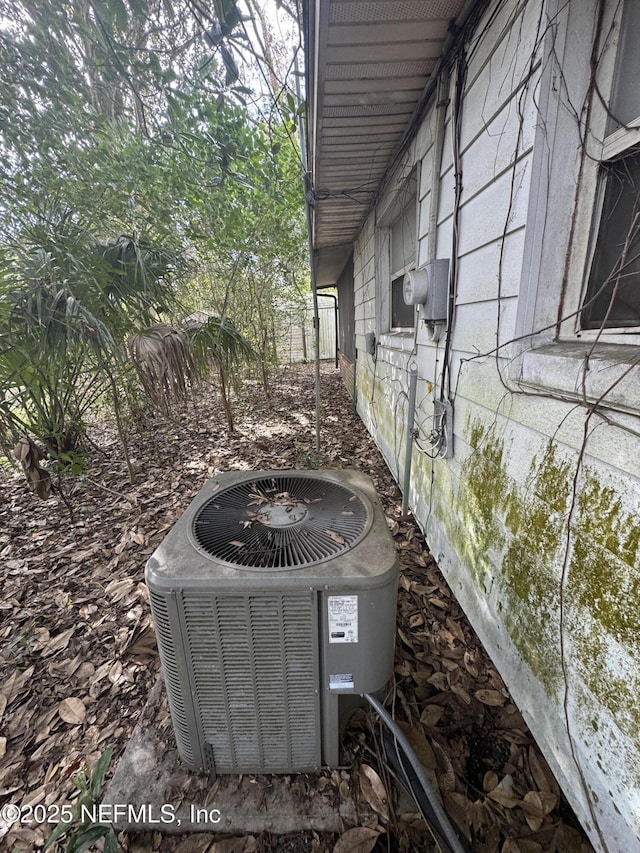 details featuring electric meter and central air condition unit