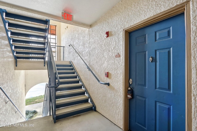 view of exterior entry featuring stucco siding