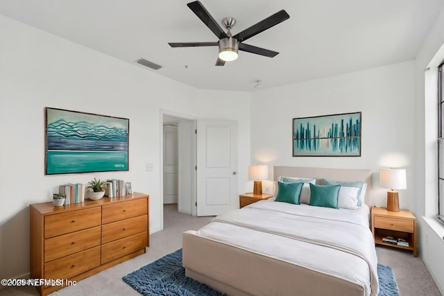 bedroom featuring visible vents, carpet flooring, and a ceiling fan