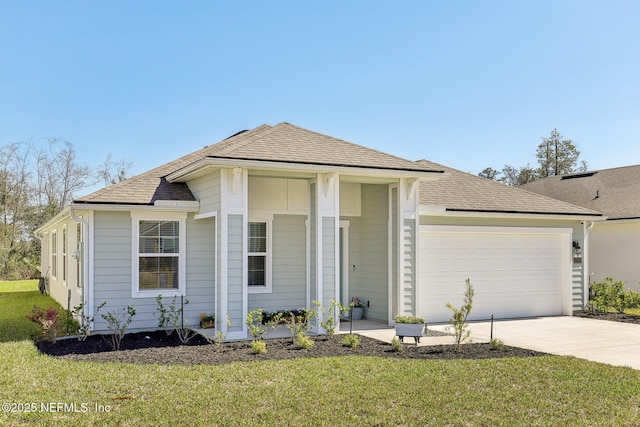 view of front facade featuring a garage, roof with shingles, driveway, and a front lawn