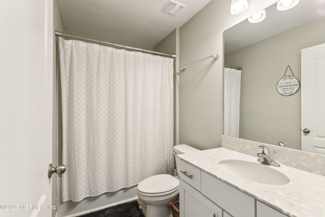 full bath with toilet, vanity, visible vents, and shower / tub combo with curtain