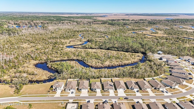 birds eye view of property featuring a water view and a residential view